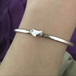 Silver bracelet with bird.